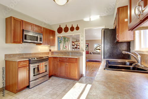 Modern kitchen with tile floor.