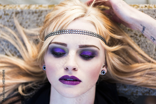 Portrait of rouged blond woman with hair-band photo