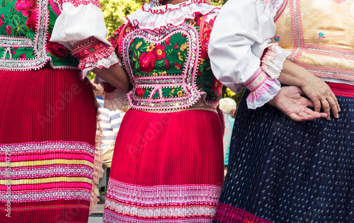 Obraz na plátne Anonymous senior female friends in folklore costumes