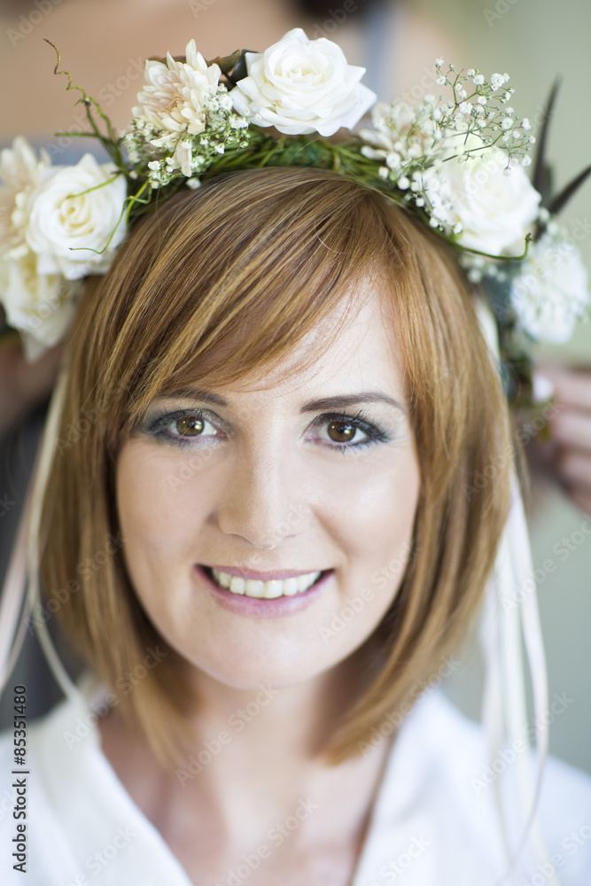 Portrait of smiling young woman wearing floral hair wreath Portrait of smiling young woman wearing floral hair wreath