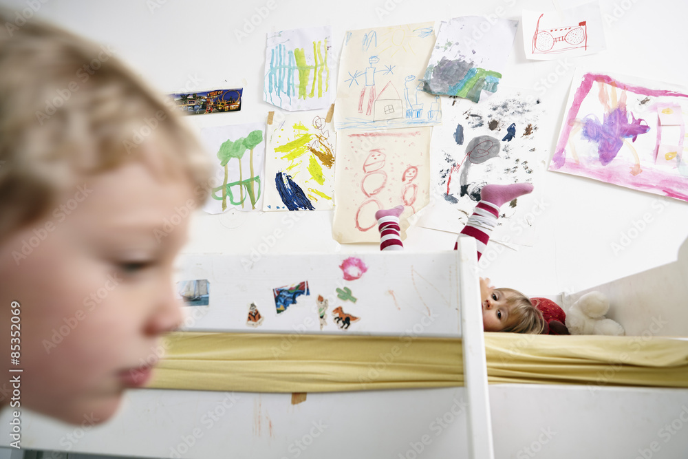Brother and sister in children's room with bunk bed Stock Photo | Adobe ...