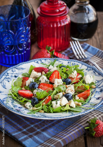 Arugula  strawberry  blueberry and blue cheese salad