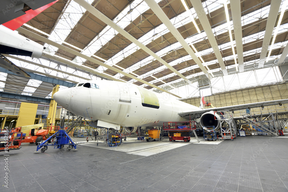 Airplane construction in a hangar Airplane construction in a hangar