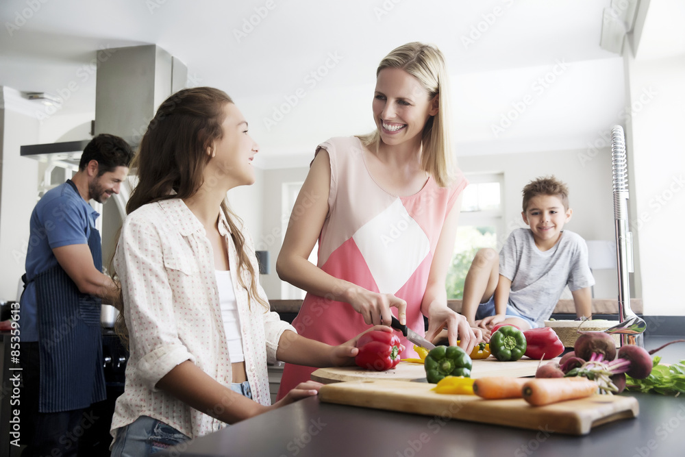 Family preparing food in kitchen Family preparing food in kitchen