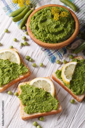 Puree peas and bread closeup. vertical top view