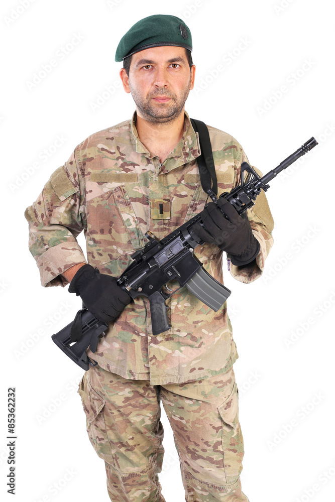 Portrait of young man in army clothes holding a weapon Portrait of young man in army clothes holding a weapon