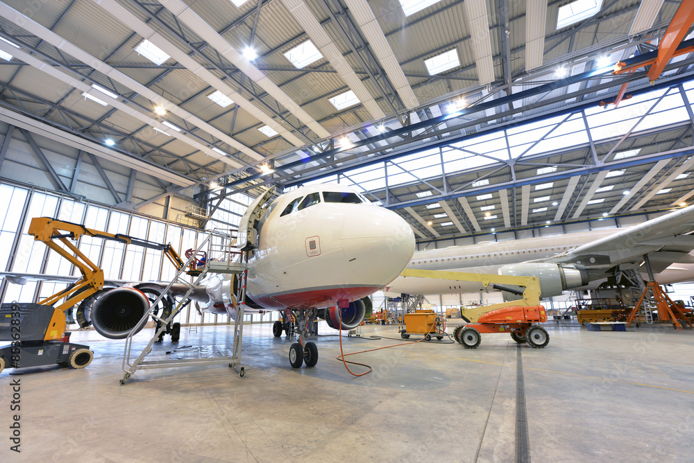 Airplane construction in a hangar Airplane construction in a hangar