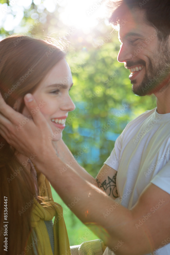 Young couple sharing an intimate moment outdoors Young couple sharing an intimate moment outdoors