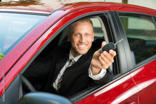 Businessman Showing New Car Key