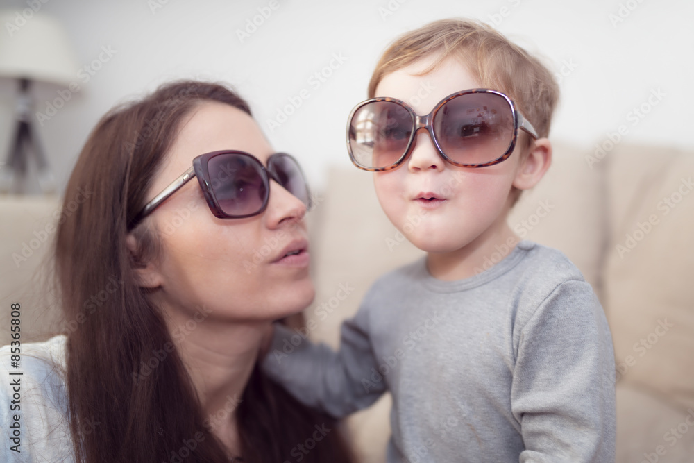 Mother and little son wearing sunglasses Mother and little son wearing sunglasses