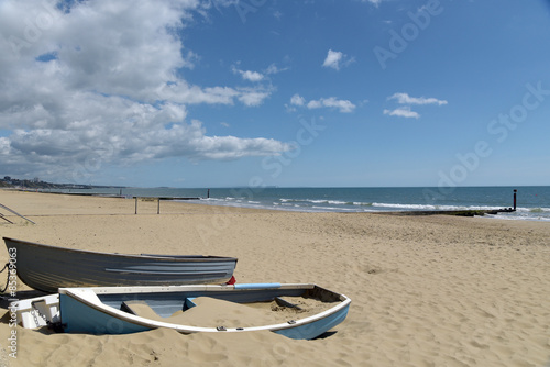Rowing boats on beach at Bournemouth, Dorset