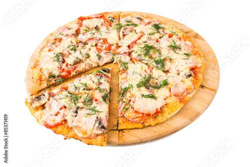 Tasty pizza on a wooden board 