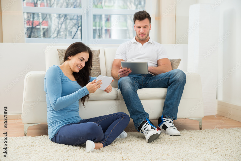 Couple Using Digital Tablet