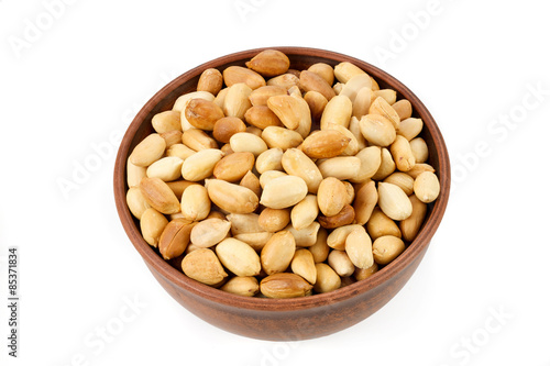 roasted peanuts in a bowl isolated