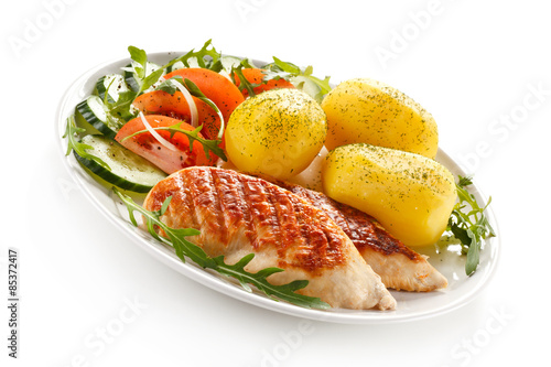 Grilled chicken fillets, boiled potatoes and vegetable salad 