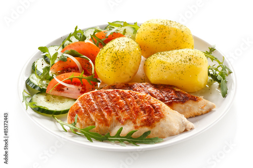 Grilled chicken fillets, boiled potatoes and vegetable salad 