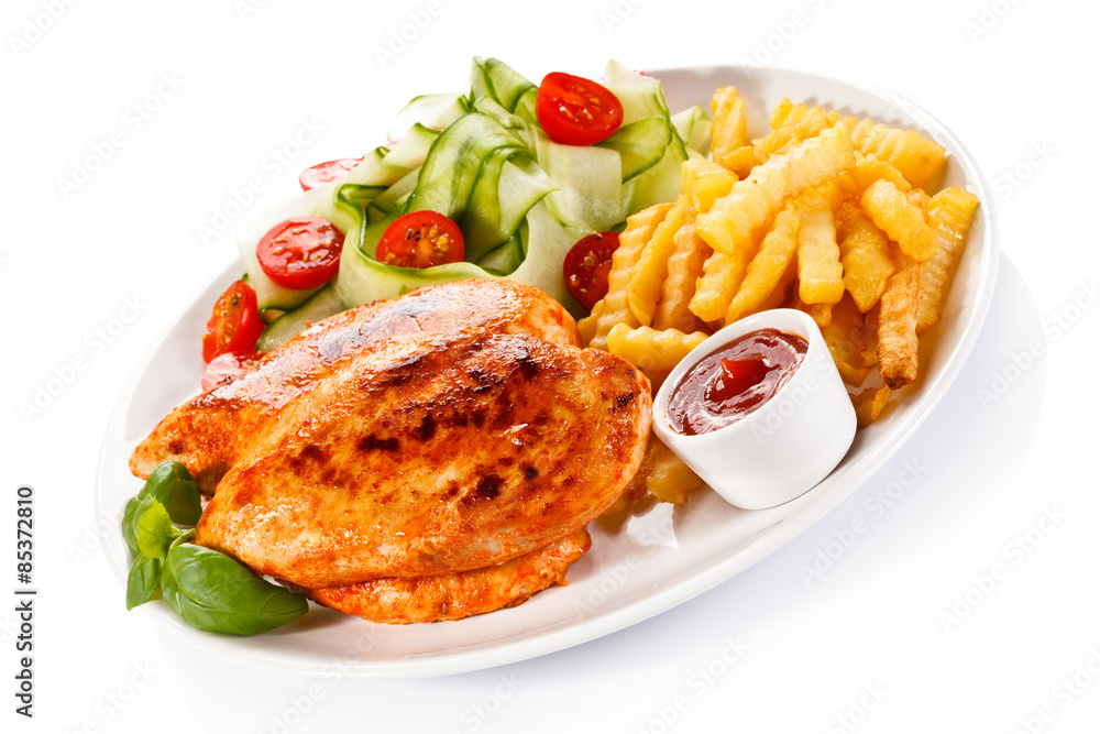 Fried chicken fillet, chips and vegetable salad Fried chicken fillet, chips and vegetable salad