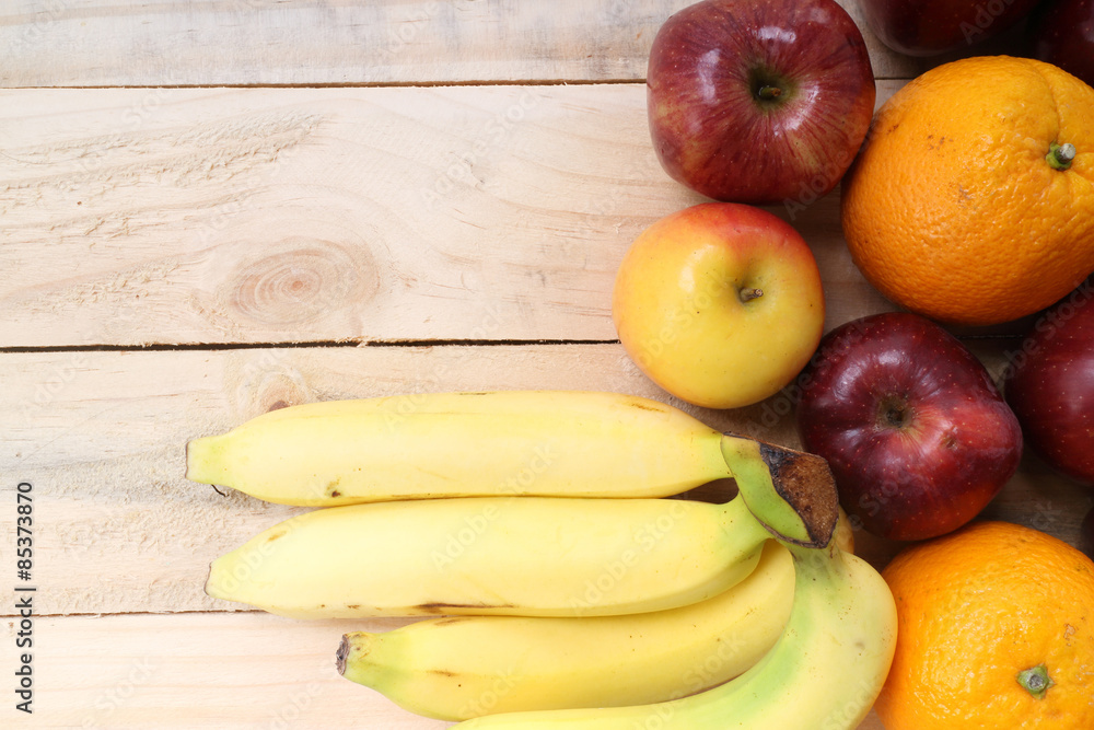 Fresh fruits on the old wooden board Fresh fruits on the old wooden board