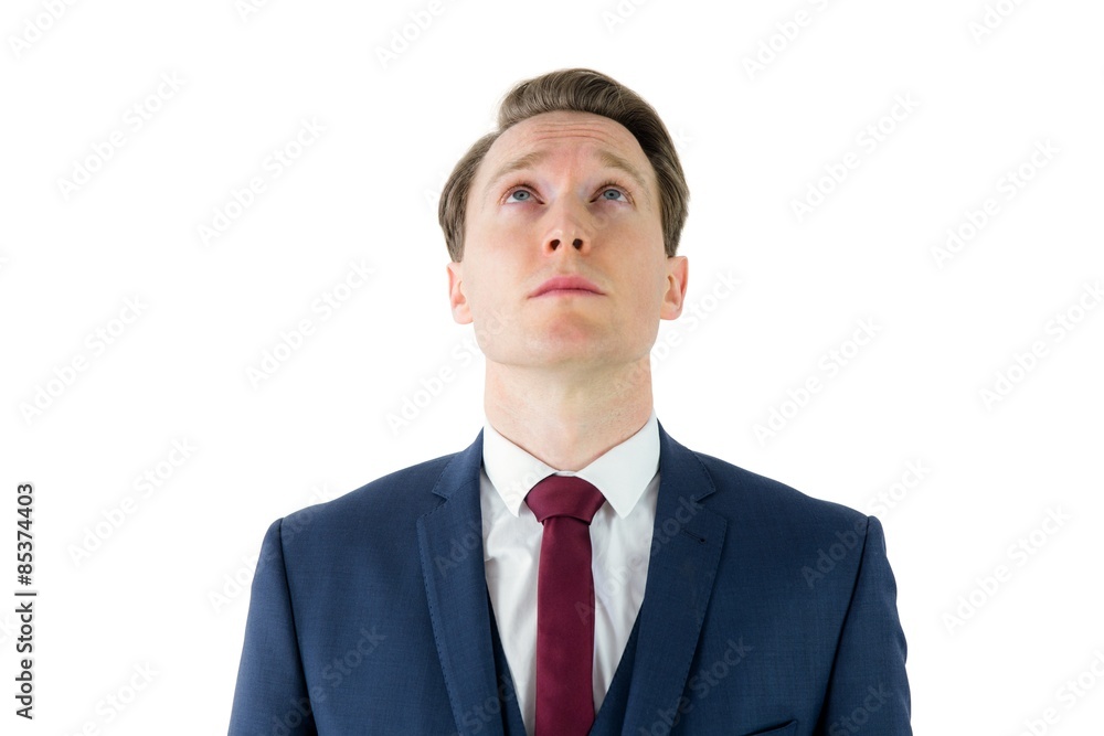 Serious businessman looking at top 