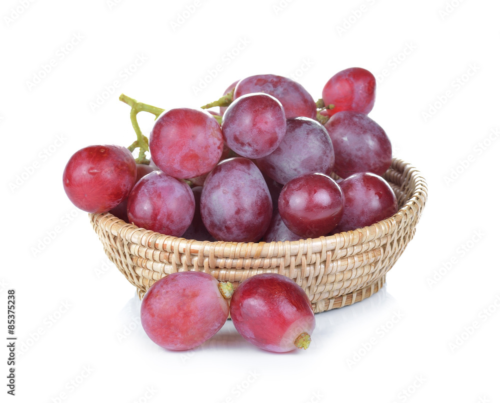 red grapes in basket on white background red grapes in basket on white background