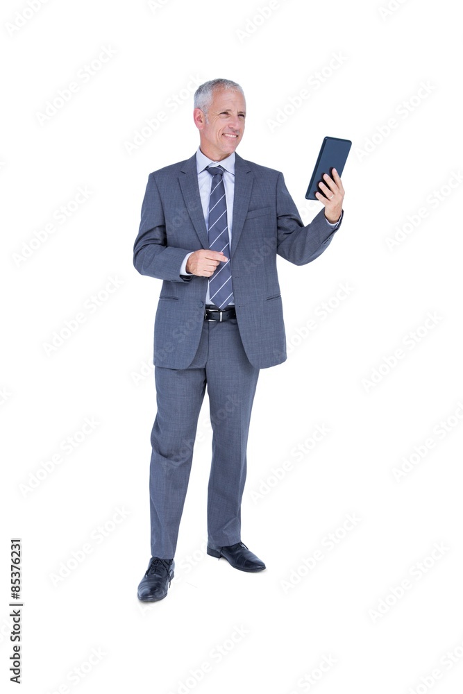 Businessman looking at tablet computer Businessman looking at tablet computer