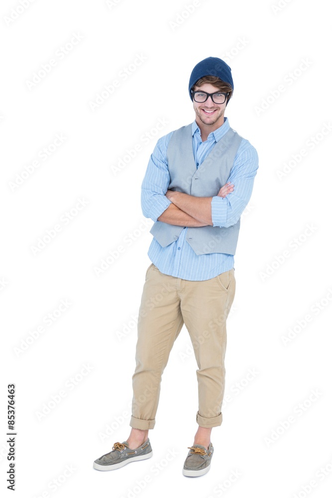 Geeky hipster with arms crossed looking at camera Geeky hipster with arms crossed looking at camera