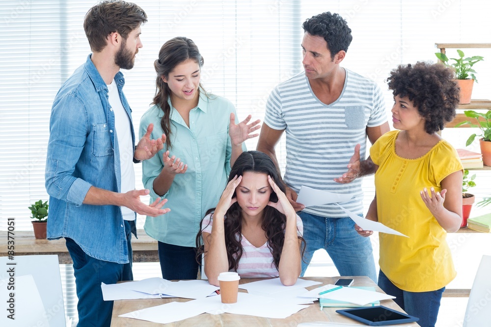 Fototapeta premium Concentrated businesswoman with her coworkers 