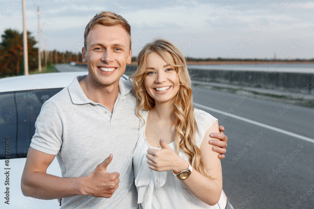 Lovely couple near the car Lovely couple near the car