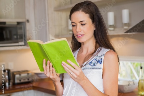 Happy pregnancy reading a book 