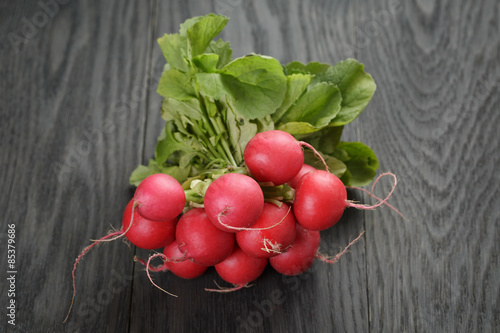 freshly harvested radishes on rustic table