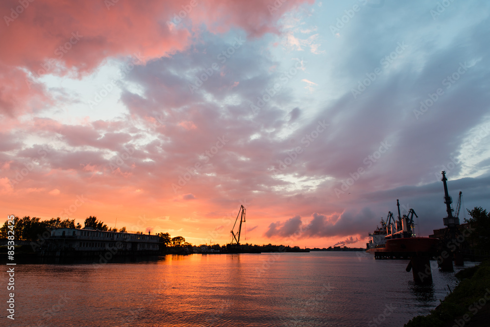 reddish sunset over port