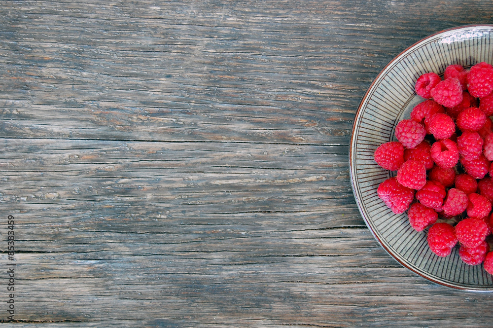 fresh fruits background with raspberries on rustic wooden table fresh fruits background with raspberries on rustic wooden table