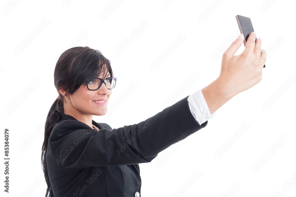 Business woman taking a selfie using smartphone Business woman taking a selfie using smartphone