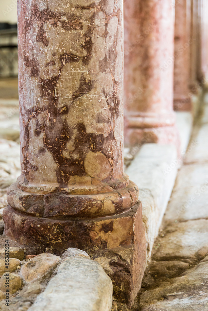 antique marble columns resting on stone floor antique marble columns resting on stone floor