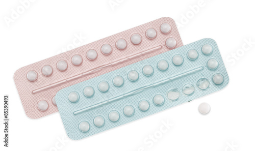 Male and female contraceptive pills, pink and blue on white