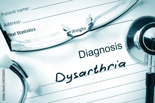 Diagnostic form with diagnosis Dysarthria  and pills. photo