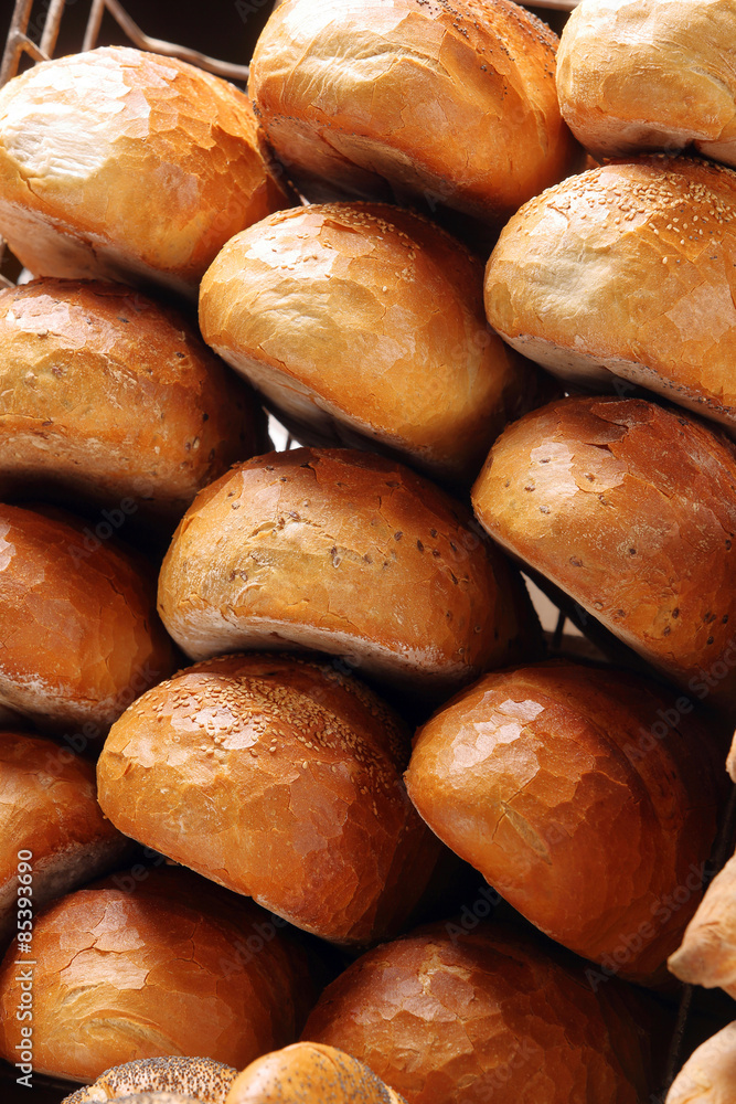Fresh bread in metal basket in bakery Fresh bread in metal basket in bakery
