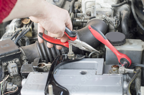 The process of repairing vehicle using pliers