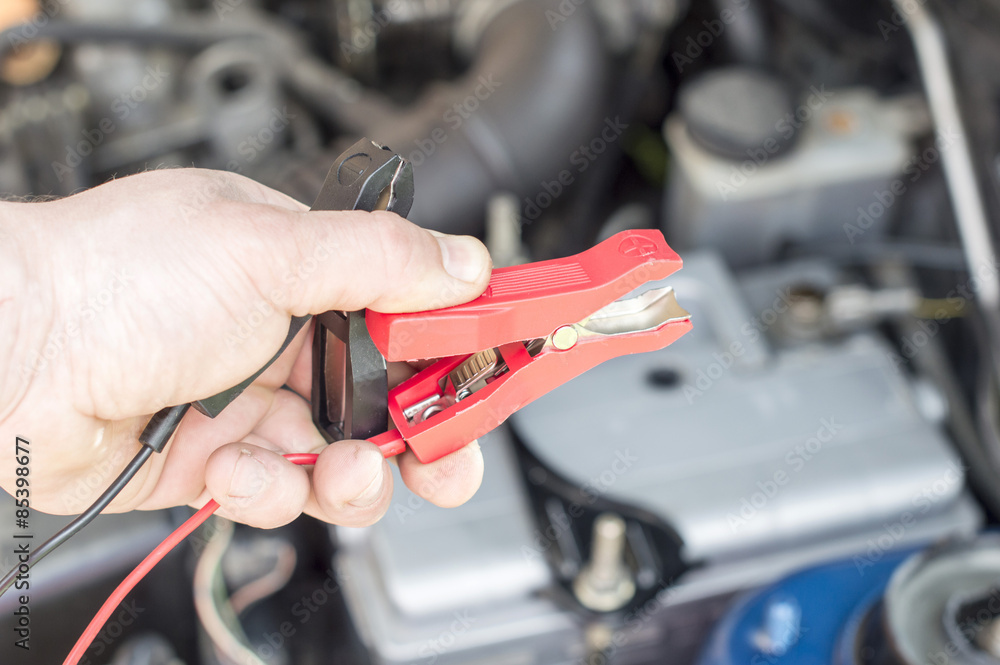 The process of connecting the charger to the the vehicle battery The process of connecting the charger to the the vehicle battery