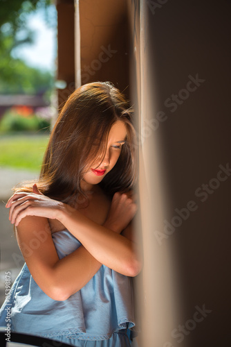 Girl with red lips in blue wearing
 photo