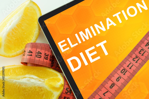 Φωτογραφία Elimination diet on tablet. Fat lost concept.