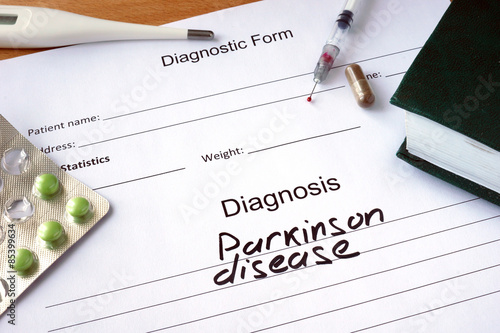 Diagnostic form with Diagnosis Parkinson disease  and pills.  photo