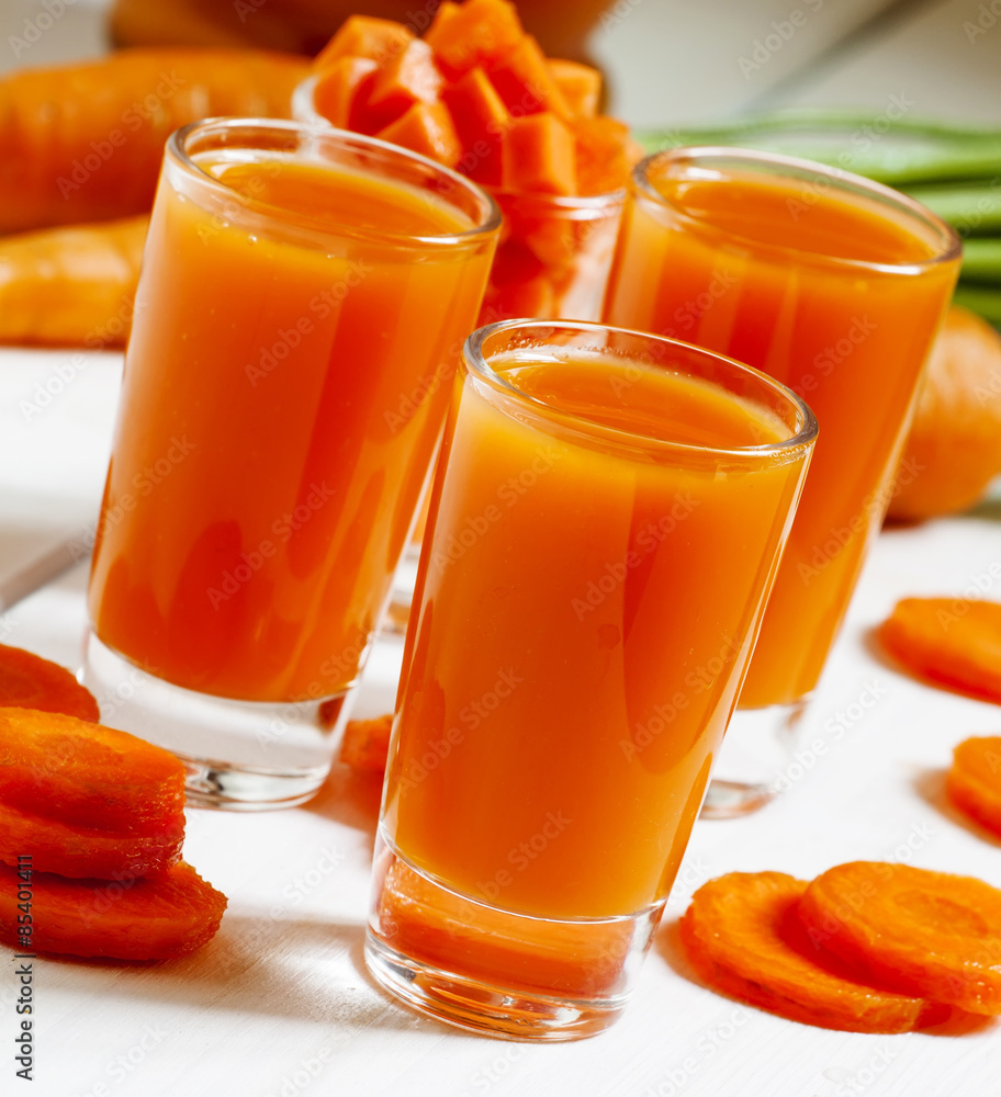 Fresh carrot cocktail glasses, selective focus Fresh carrot cocktail glasses, selective focus