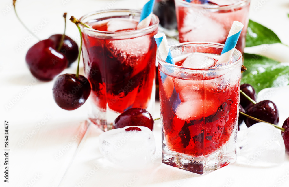 Cherry red drink with ice in a heart shape, selective focus Cherry red drink with ice in a heart shape, selective focus