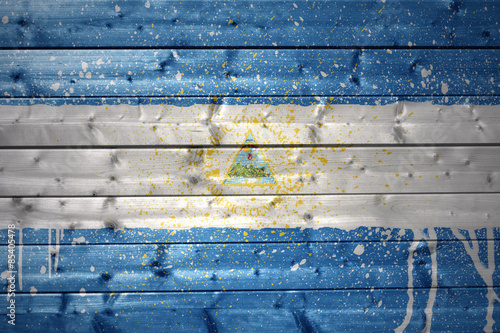 painted nicaraguan flag on a wooden texture