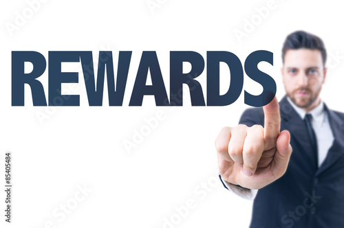 Business man pointing the text: Rewards
