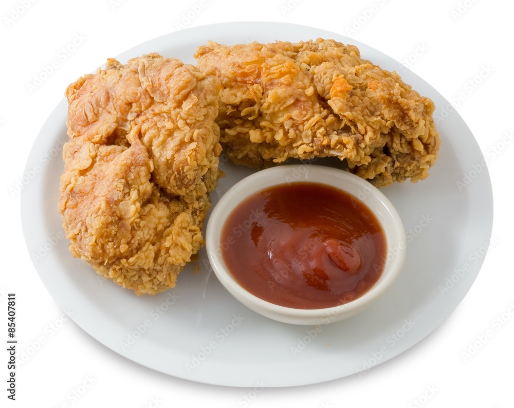 Fried Chicken with Sauce on A White Dish Fried Chicken with Sauce on A White Dish
