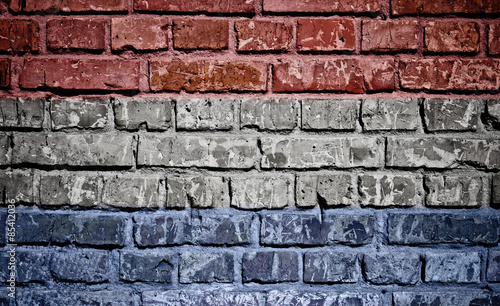 Netherlands flag painted on old brick wall texture background 