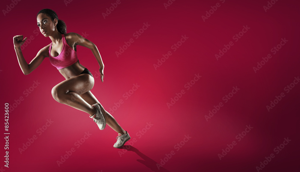 Sport. Athlete runner in silhouettes on red background