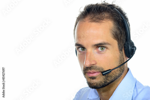 Handsome customer service operator wearing a headset